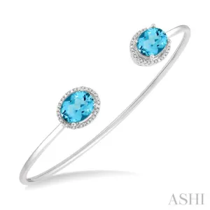 1/10 ctw Oval Shape 9x7 MM Blue Topaz & Round Cut Diamond Bangle in Sterling Silver