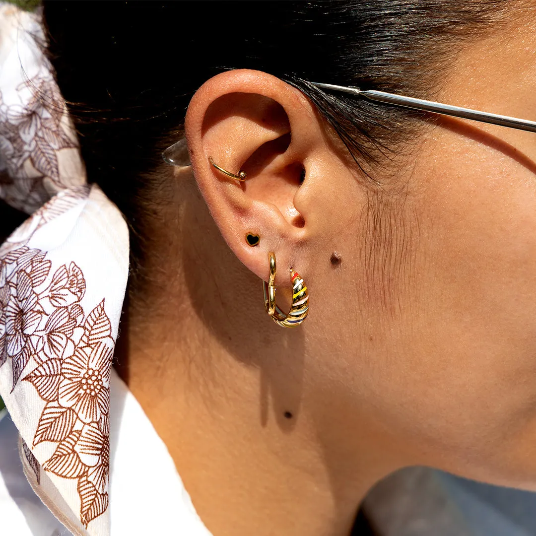Gold coloured hoop earrings with a heart shape